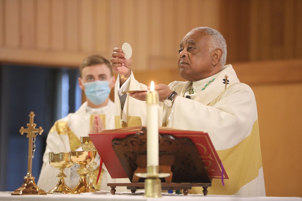Washington Archbishop Wilton Gregory, who four hours earlier had learned Pope Francis had named him a cardinal, celebrates his first Mass as a cardinal-designate Oct. 25, at Holy Angels Church in Avenue, Maryland. (CNS/Catholic StandardAndrew Biraj)