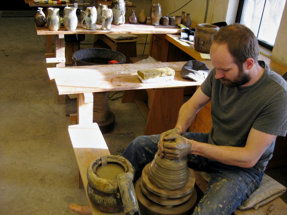 Apprentice Brandon Russell works at the potter's wheel in the St. John's Pottery studio in Collegeville, Minnesota. (Zoe Ryan)