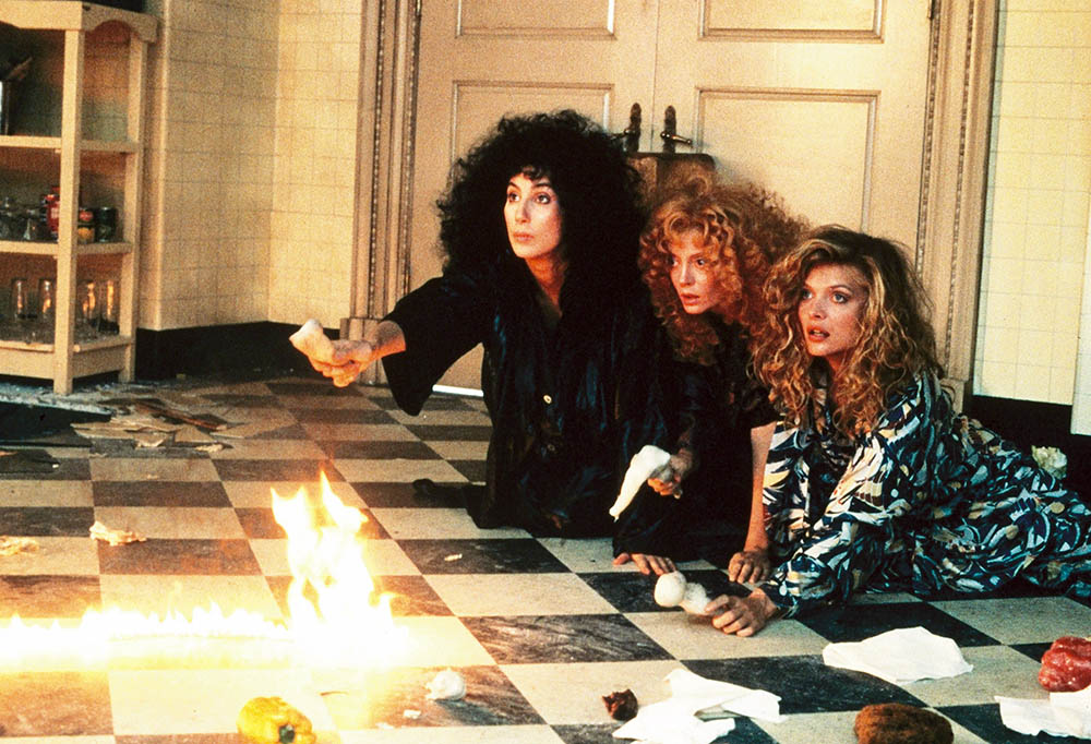 From left: Cher, Susan Sarandon and Michelle Pfeiffer in a scene from the 1987 movie "The Witches of Eastwick" (Newscom/Album/Warner Bros.)