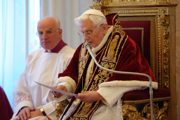 Pope Benedict XVI reads his resignation in Latin during a meeting of cardinals at the Vatican Feb. 11, 2013.(CNS/L'Osservatore Romano)