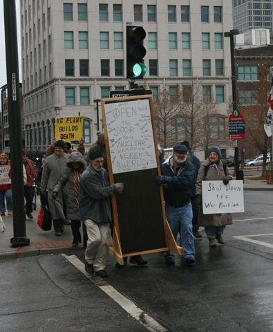 Local activists march to the Kansas City Municipal Courthouse Dec. 13 with a door that was entered into evidence. (Photos courtesy of Jim Hannah)