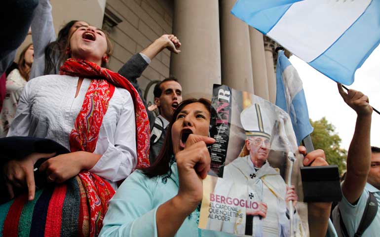 People celebrate the election of Pope Francis outside the Metropolitan Cathedral in Buenos Aires, Argentina, March 13, 2013. (CNS/Reuters/Enrique Marcarian)