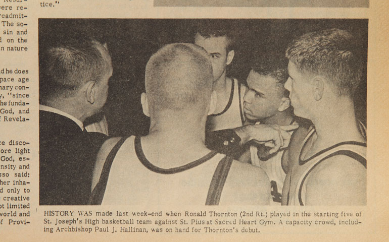 A photograph that appeared on the Jan. 17, 1963, cover of The Georgia Bulletin inspired this article's look back at the desegregation of Georgia Catholic schools. The photo was of an Atlanta Catholic high school basketball game at which, for the first time, white and black players were on a team together. The caption said Archbishop Paul Hallinan attended the game. (Courtesy of The Georgia Bulletin)