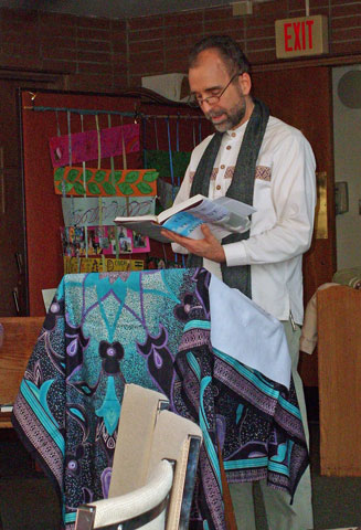 Joe Regotti reads from Scripture during a December liturgy in which 12 new Maryknoll Lay Missioners formalized their commitments to mission. (Eric Cambier)