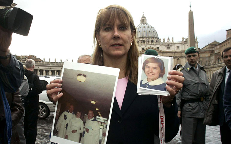 Barbara Blaine, holding a photo of herself as a child, protests at the Vatican in April 2005. (ZUMA Press/La Presse/Mauro Scrobogna)