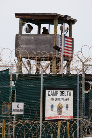 A U.S. soldier stands in a guard tower overlooking Camp Delta U.S. Naval Base in Guantánamo Bay, Cuba, in October 2007. (EPA/Shawn Thew)