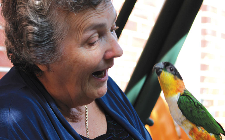 Benedictine Sr. Joan Chittister and Lady Hildegard the parrot