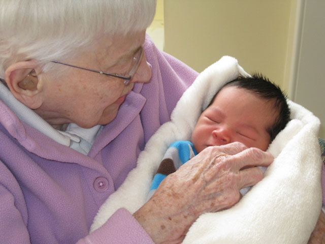 Benedictine Sr. Esther Bataille, 99 years old, holds Aasim, 99 hours old, on Jan. 10, 2011. (Photos by Sr. Kathleen McNany, OSB)