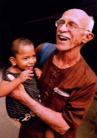 Maryknoll Fr. Bob McCahill with a young friend in Bangladesh in 2012