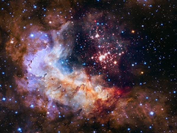 The brilliant tapestry of young stars flaring to life resemble a glittering fireworks display in the 25th anniversary NASA Hubble Space Telescope image, released to commemorate a quarter century of exploring the solar system and beyond since its launch on April 24, 1990. (NASA)