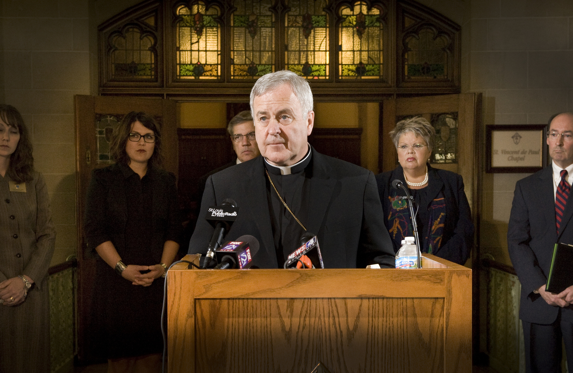 Archbishop Robert J. Carlson announces in May that the Archdiocese of St. Louis and Catholic Charities of St. Louis are among 43 Catholic entities filing suit against implementation of the HHS mandate. (CNS photo/Lisa Johnston, St. Louis Review)