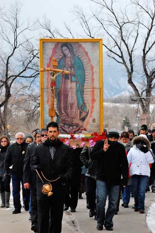 Today is the feast day of Our Lady of Guadalupe. A man swings a censer during a procession with an image of Our Lady of Guadalupe around St. Mary Cathedral before the annual celebration in downtown Colorado Springs, Colo., Dec. 9.  