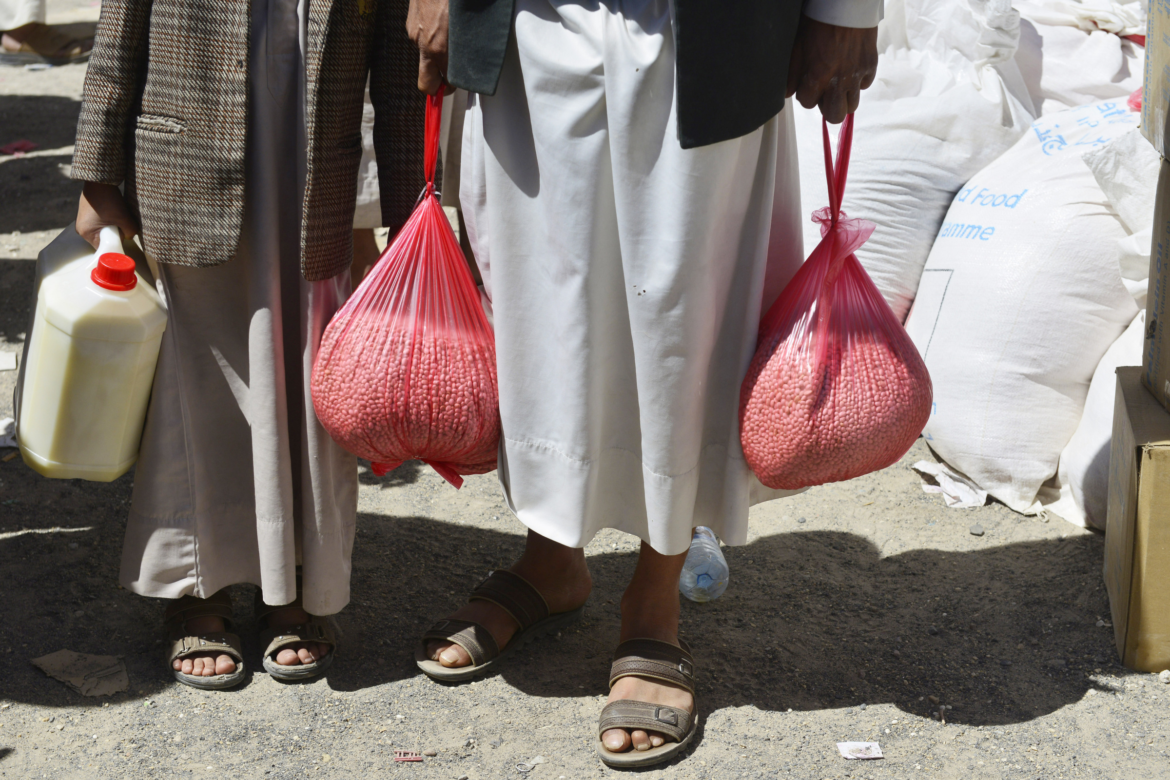 Yemenis receive food at a distribution center in Sana'a, Yemen, Feb. 13. (CNS/EPA/Yahya Arhab)