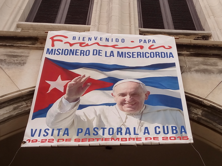 A sign outside Havana's parish of the Sacred Heart of Jesus and Ignatius of Loyola welcoming Pope Francis to Cuba. (NCR photos/Joshua J. McElwee)