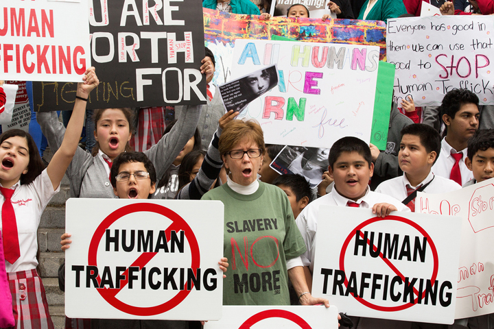 People display signs in Los Angeles during the Jan. 9 "Walk 4 Freedom" in advance of National Human Trafficking Awareness Day, Jan. 11, 2015. (CNS/Victor Aleman, Vida Nueva)