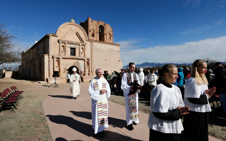 Bishop Gerald Kicanas of Tucson, Ariz., walks with his crosier after celebrating Mass outside the mission at Tumacacori National Historical Park in Tumacacori, Ariz., Jan. 10. The Mass was part of the park's Kino Legacy Day marking the 325th anniversary of the Jesuit missionary's first visit to an O'odham village there. (CNS photo/Nancy Wiechec)