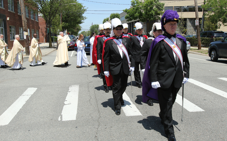 A Knights of Columbus honor guard leads a eucharistic procession on the feast of Corpus Christi in Corpus Christi Parish in Mineola, N.Y. (CNS/Gregory A. Shemitz)