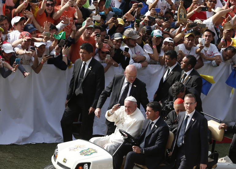 Pope Francis greets the crowd from a golf cart as he arrives for a meeting with young people at the Jose Maria Morelos Pavon Stadium in Morelia, Mexico, Feb. 16. (CNS photo/Paul Haring) 