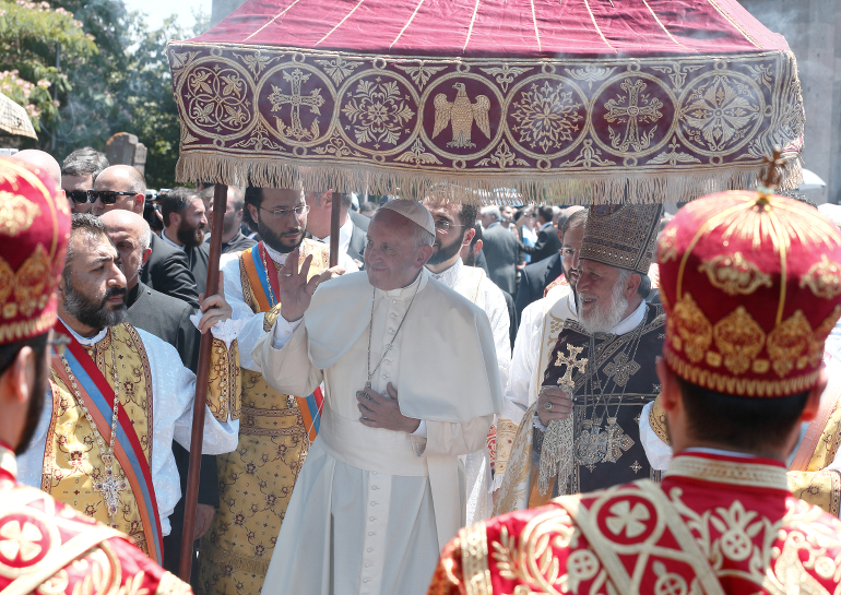 Pope Francis and Catholicos Karekin II, patriarch of the Armenian Apostolic Church, greet the crowd after participating in a divine liturgy at Etchmiadzin in Vagharshapat, Armenia, June 26. (CNS photo/Paul Haring)