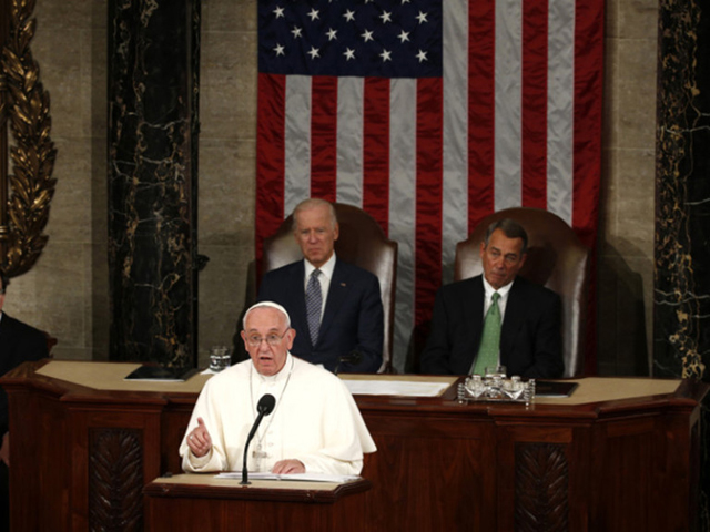 Pope Francis addresses a joint meeting of the U.S. Congress as Vice President Joe Biden, left, and Speaker of the House John Boehner, right, look on in the House of Representatives' chamber on Capitol Hill in Washington on Sept. 24, 2015. (Reuters/Kevin Lamarque)