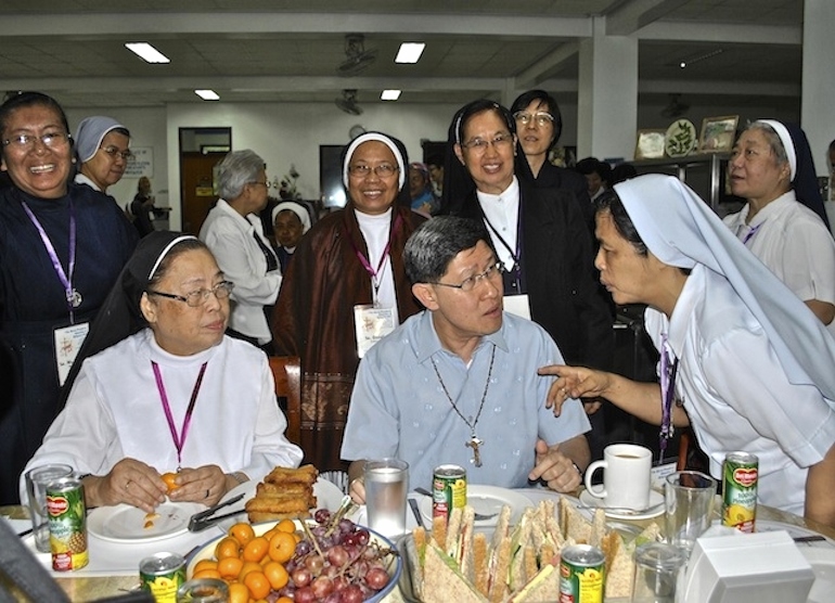 Cardinal Luis Tagle of Manila had breakfast with nuns from around the region and other continents after celebrating the Mass that opened their XVI Asia Oceania Meeting of Religious women in Tagaytay City on Nov. 2013. (N.J. Viehland)
