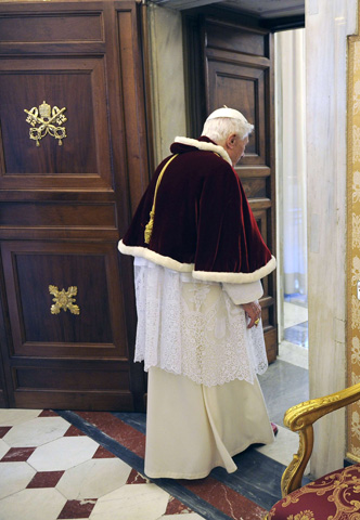 Pope Benedict XVI leaves following an audience with Romanian President Traian Basescu at the Vatican Feb. 15. (CNS/Reuters/pool)