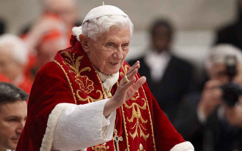 Pope Benedict XVI greets the crowd as the arrives to make remarks at the end of a Mass for the Knights of Malta in St. Peter's Basilica  on Saturday at the Vatican. (CNS/Paul Haring) 