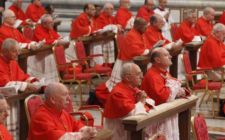 Cardinals pray during a 2012 Mass for new cardinals celebrated by Pope Benedict XVI in St. Peter's Basilica at the Vatican. (CNS/Paul Haring)