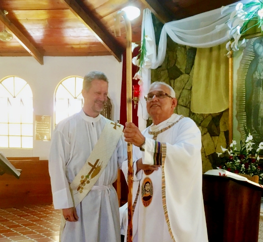 Deacon Nate Bacon, left, coordinated the transportation and May 2 presentation of a crosier as a gift to Bishop Alvaro Ramazzini, right, of Huehuetenango, Guatemala. (Photo courtesy of Poor Clare Monastery of Our Lady of Guadalupe, Huehuetenango)