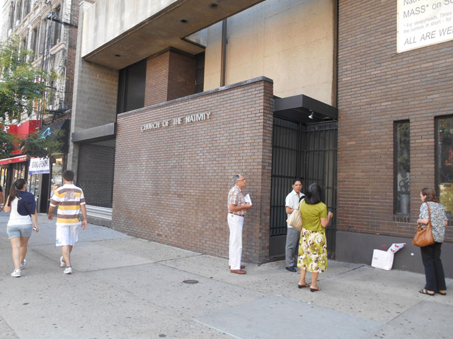 A small group of protesters praying the Rosary outside of Nativity church, Second Avenue on the Lower East Side in New York. The church officially closed Aug. 1. (Mercedes Gallese)