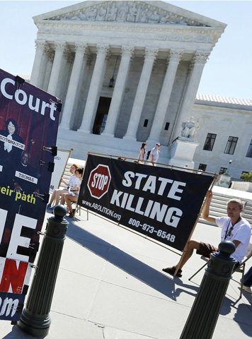 Protesters against the death penalty gather in front of the U.S. Supreme Court building Monday in Washington. (CNS/Reuters/Jonathan Ernst)