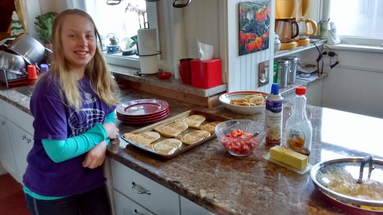 Emmaly, 10, is helpful in the kitchen. (NCR photo/Amy Morris-Young)