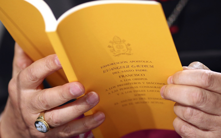 A copy of the apostolic exhortation "Evangelii Gaudium" ("The Joy of the Gospel") by Pope Francis at a news conference at the Vatican on Tuesday. (CNS/Reuters/Alessandro Bianchi)