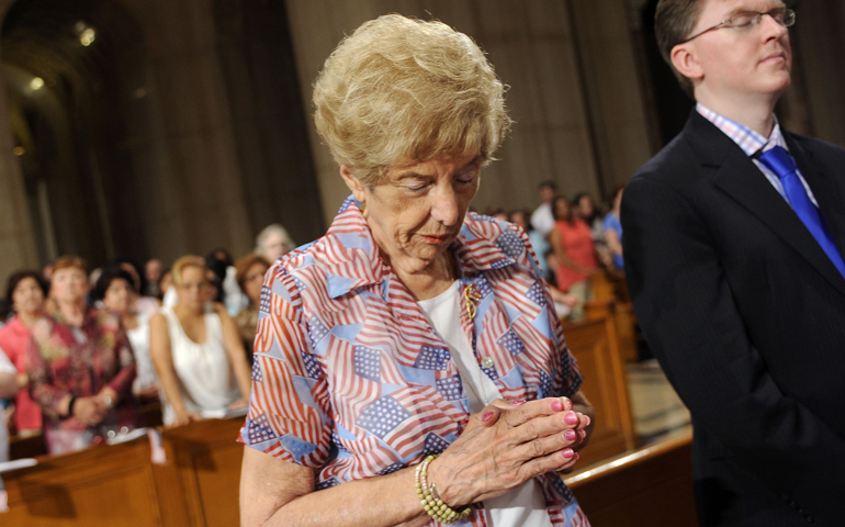 A woman prays during the 2013 Fortnight for Freedom closing Mass at the Basilica of the National Shrine of the Immaculate Conception in Washington. (CNS/Leslie E. Kossoff)