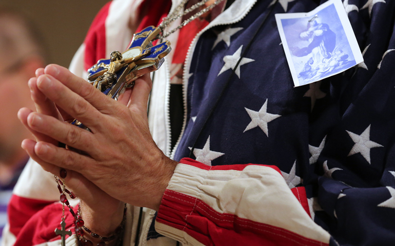 A worshipper prays during a July 4 Mass at the Basilica of the National Shrine of the Immaculate Conception in Washington (CNS/Bob Roller)