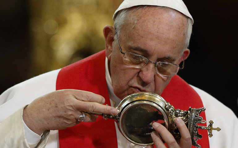 Pope Francis kisses a reliquary containing what is believed to be the blood of St. Januarius during a meeting with religious Saturday at the cathedral in Naples, Italy. (CNS/Paul Haring)