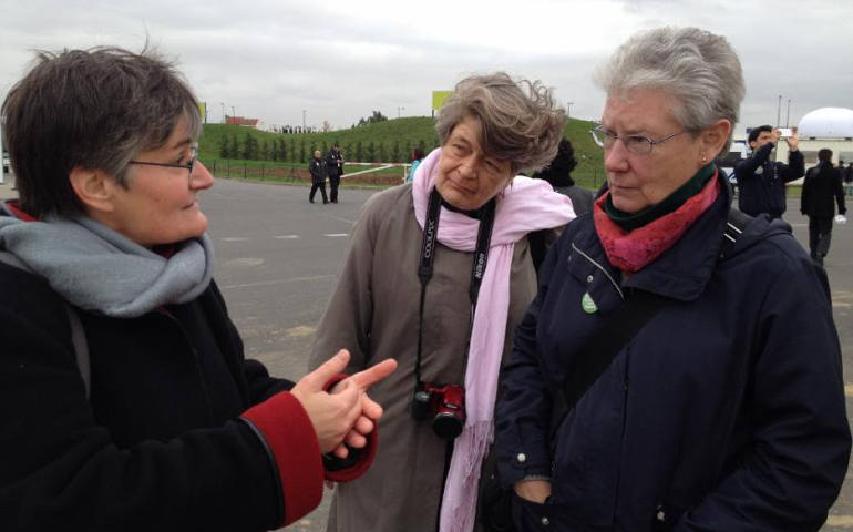 Srs. Odile Coirier, Pat Daly and Margaret Mayce talk near entrance to Climate Generations space. (Elise D. Garcia)