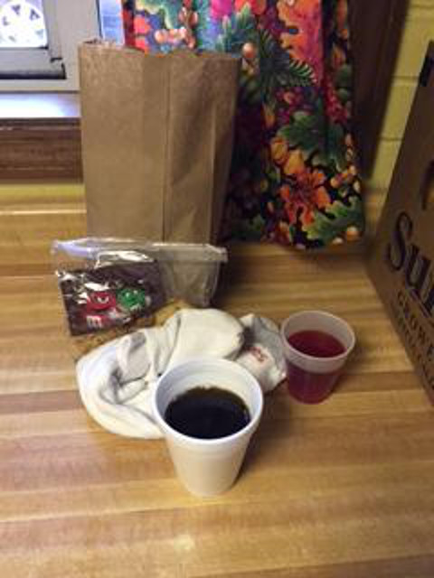Two bologna sandwiches, fruit and a snack cake or cookies are included in the more than 100 daily sack lunches provided to persons headed to work or out of work by St. Bernard Parish in Akron, Ohio. Coffee and juice is also provided. (Photo courtesy of the St. Bernard Bag Lunch Program)