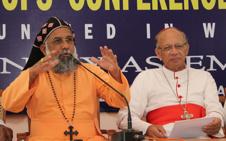 Cardinal Baselios Thottunkal, major archbishop of the Syro-Malankara church, gestures during a news conference Wednesday at the end of a weeklong bishops' conference assembly in Palai . At right is Cardinal Oswald Gracias, outgoing bishops' conference president. (CNS/Anto Akkara) 