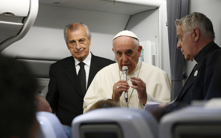 Pope Francis answers questions from journalists aboard his July 12 flight from Asuncion, Paraguay, to Rome. (CNS/Paul Haring)