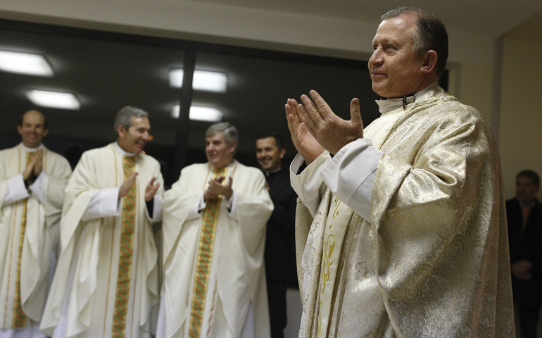 Mexican Fr. Eduardo Robles Gil, the new general director of the Legionaries of Christ, acknowledges fellow Legionaries' applause after celebrating Mass Thursday at the order's Center for Higher Studies in Rome. (CNS/Paul Haring) 