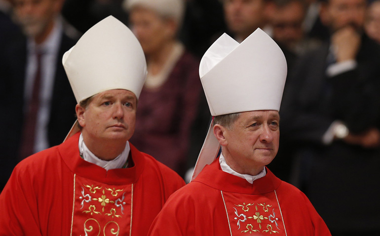 Archbishops Anthony Fisher of Sydney and Blase Cupich of Chicago leave after attending Pope Francis' celebration of Mass on Monday marking the feast of Sts. Peter and Paul in St. Peter's Basilica at the Vatican. (CNS/Paul Haring)
