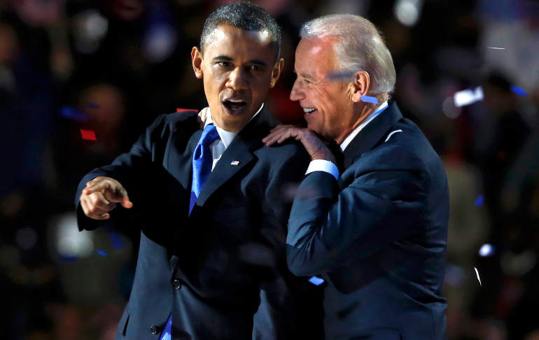 U.S. President Barack Obama and Vice President Joe Biden appear on stage during their election victory rally in Chicago Nov. 7. They return to office for a second term after defeating Republican challengers Mitt Romney and Paul Ryan. (CNS photo/Larry Dow ning, Reuters) 