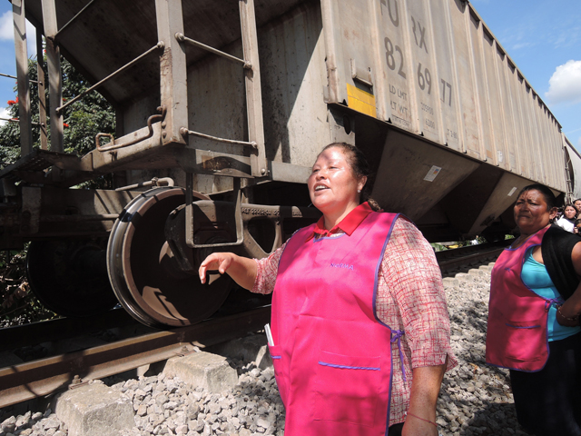 Norma Romero Vasquez walks the railway line Feb. 14 in La Patrona, Mexico. (CNS/David Agren) 