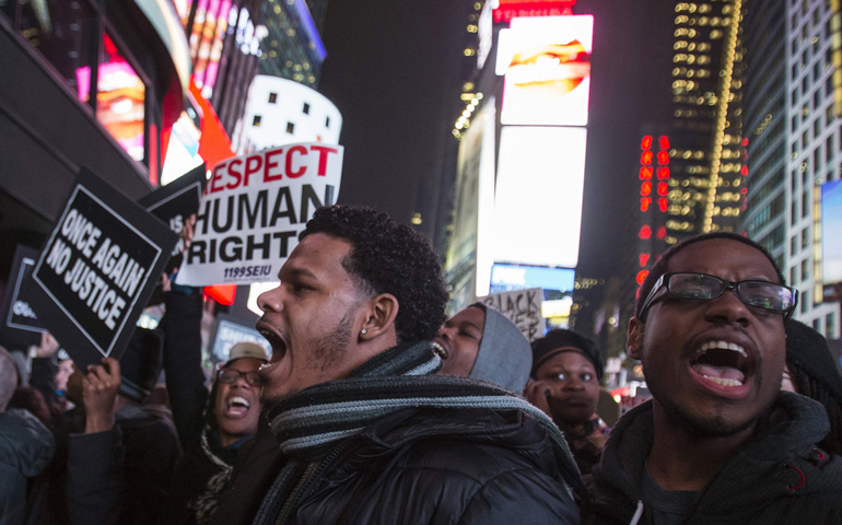 Protesters shout slogans Dec. 3 in Times Square in Manhattan, N.Y. (CNS/Reuters/Adrees Latif)