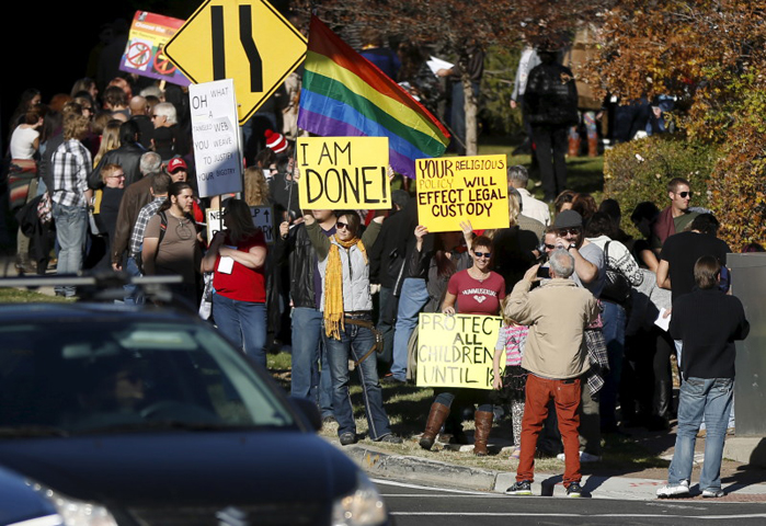 Members of The Church of Jesus Christ of Latter-day Saints and their supporters gather to resign their membership to the church in Salt Lake City, Utah November 14, 2015. Hundreds of Mormons are expected to mail letters resigning from the faith after gathering in Salt Lake City on Saturday to protest a new church policy that calls married same-sex couples apostates and bars their children from baptism. (Reuters/Jim Urquhart)
