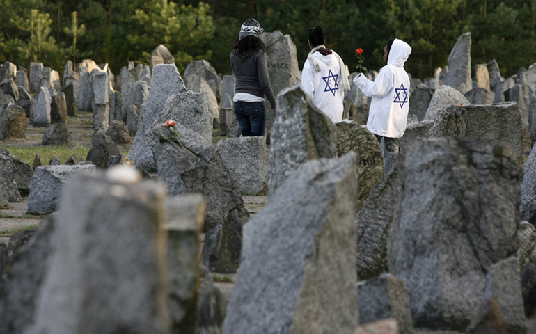 Israeli youths stand amongst stones at the Treblinka Nazi Death Camp memorial in eastern Poland on April 14, 2008. (RNS/Reuters/Kacper Pempel)