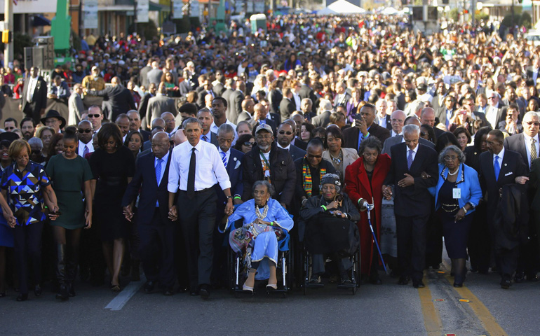 U.S. President Barack Obama and his family participate in a march across the Edmund Pettus Bridge on March 7 in Selma, Ala. (CNS/Reuters/Jonathan Ernst)