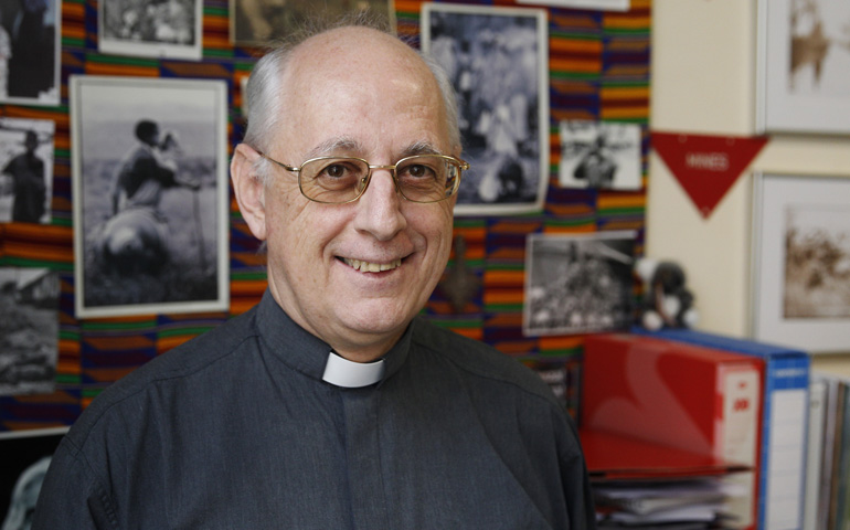 Dutch Fr. Frans Thoolen, a member of the Society of African Missions, has dedicated much of his life working directly with uprooted people, often far from public view. He is pictured in his office Tuesday in Rome. (CNS/Paul Haring)