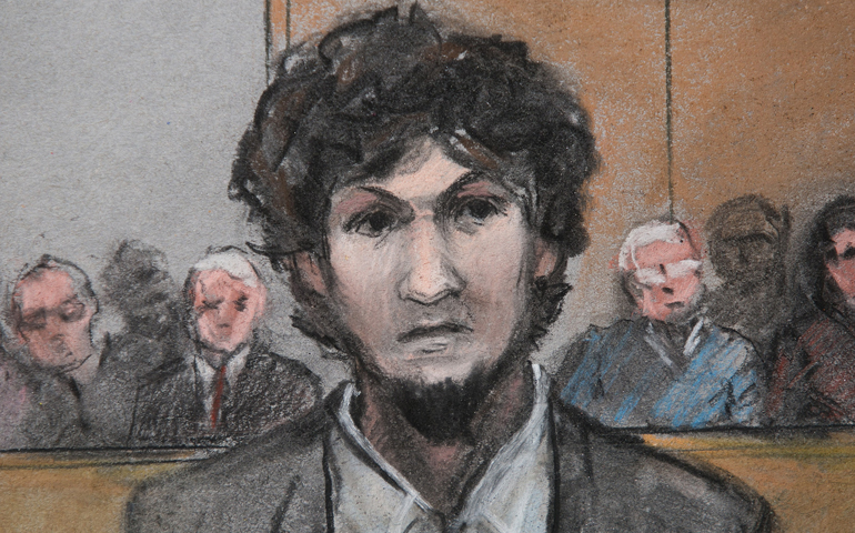 In this courtroom sketch, convicted Boston Marathon bomber Dzokhar Tsarnaev stands as he is sentenced to death May 15 at the U.S. courthouse in Boston. (CNS illustration/EPA/Jane Flavell Collins)